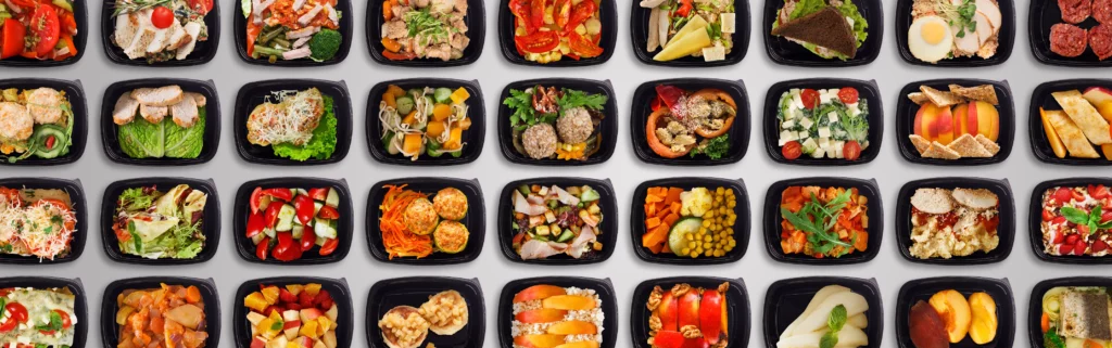 image with many takeaway containers with different kinds of foods