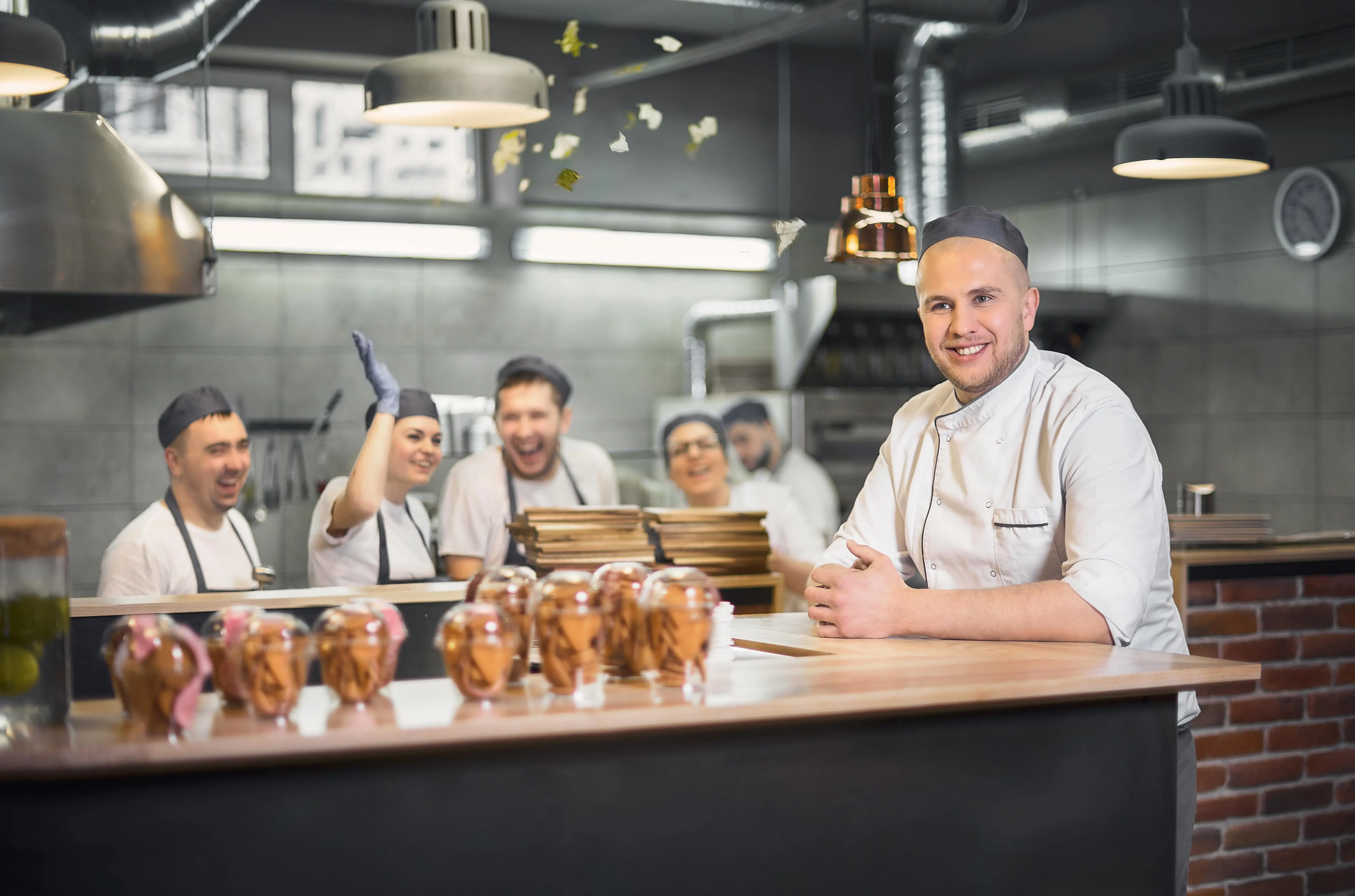 Kitchen staff having fun in a professional kitchen