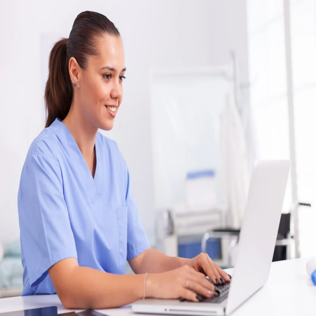 nurse working on laptop