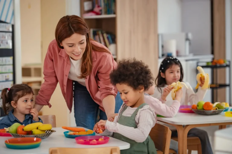 kindergarten teacher supervising lunch in kindergarten
