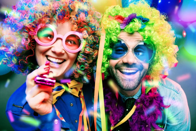 two people in colorful carneval costumes